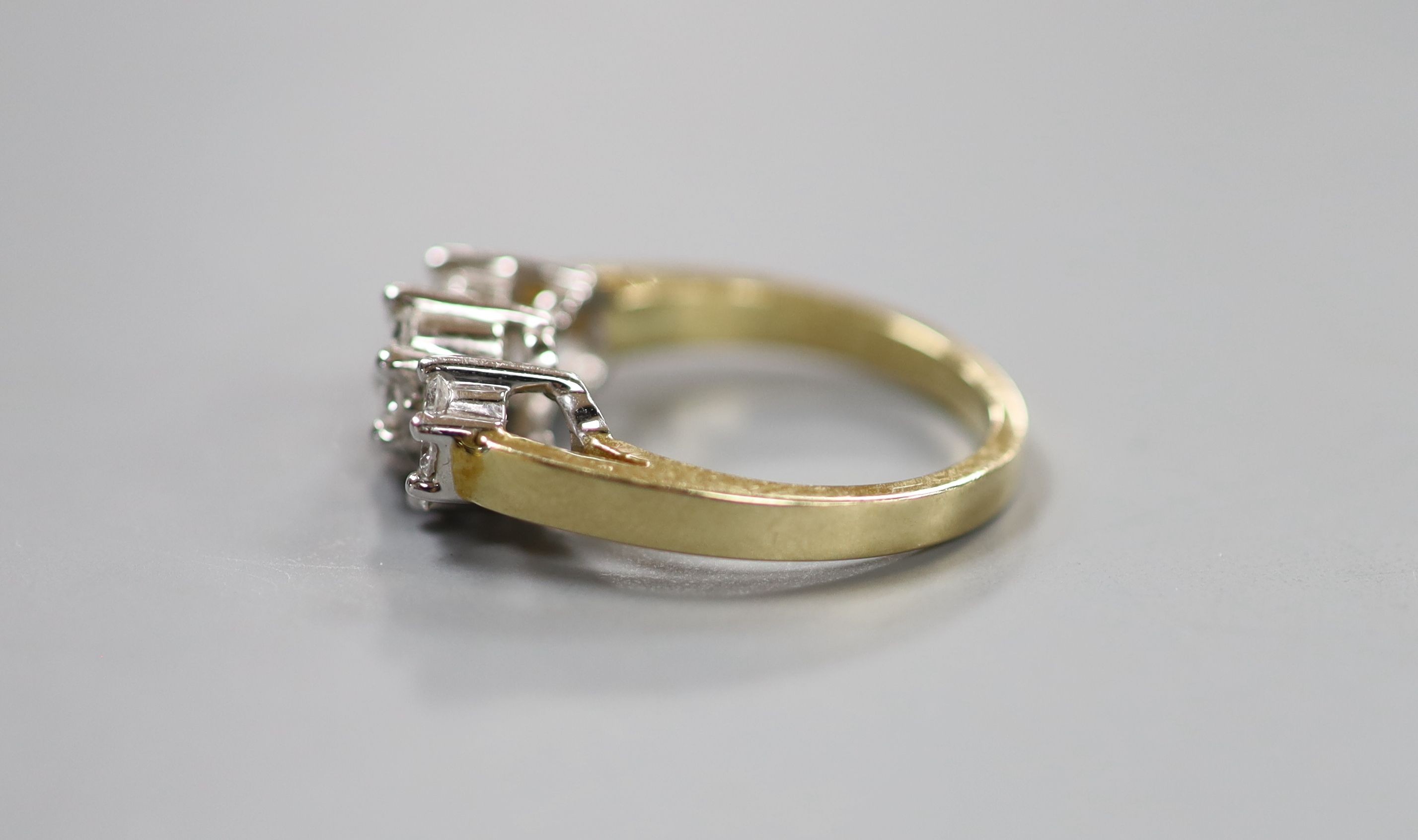 A modern 14k and diamond set triple cluster ring, size O, gross weight 6.3 grams.